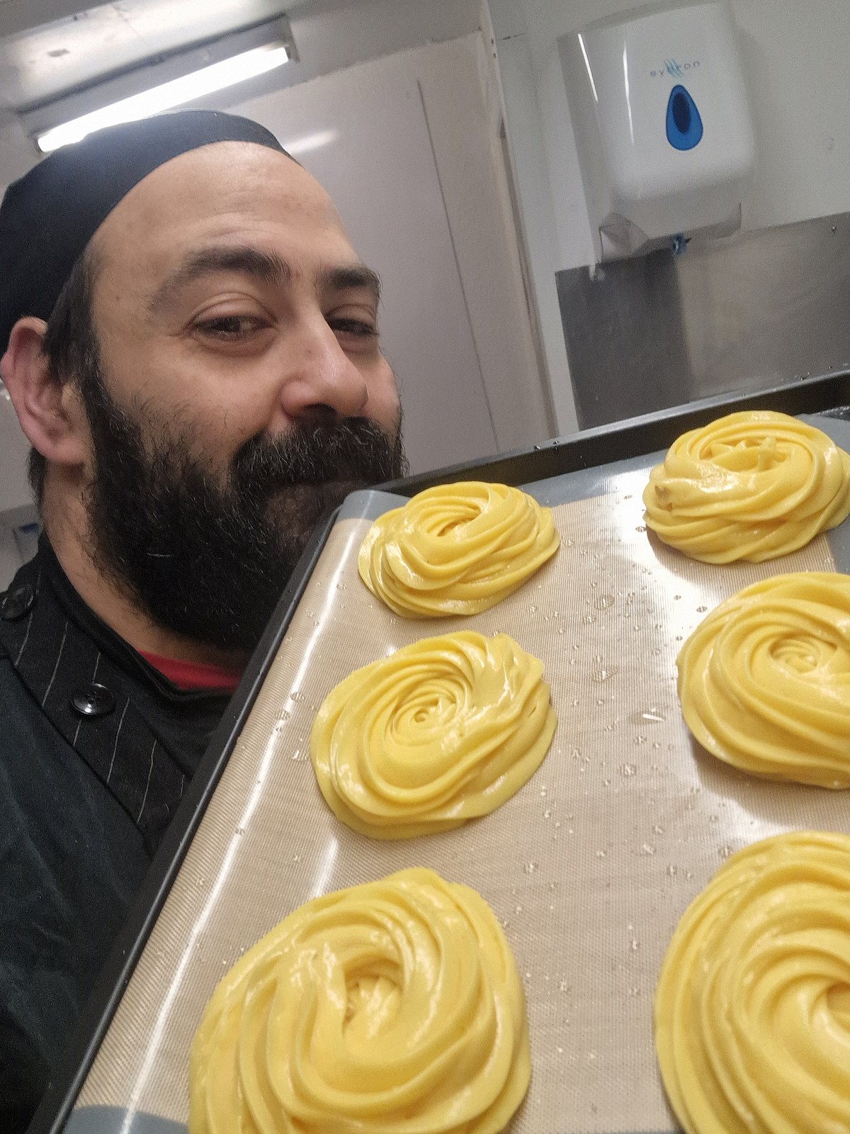 Chef Francesco Palumbo with a tray of freshly piped zeppole